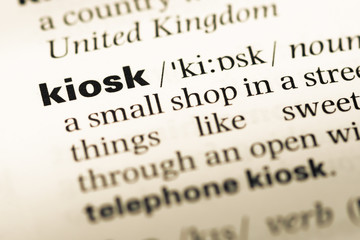 Obraz premium Close up of old English dictionary page with word kiosk