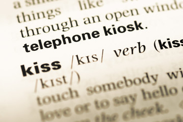 Fototapeta premium Close up of old English dictionary page with word telephone kios
