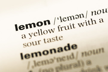 Close up of old English dictionary page with word lemon