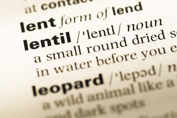 Close up of old English dictionary page with word lentil