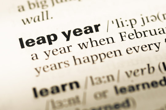 Close up of old English dictionary page with word leap year