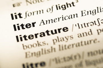 Fototapeta premium Close up of old English dictionary page with word liter