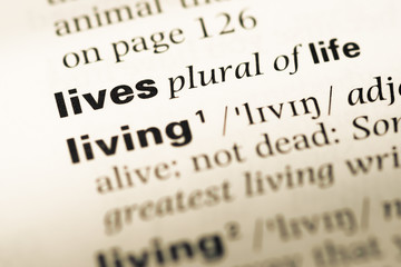 Fototapeta premium Close up of old English dictionary page with word lives