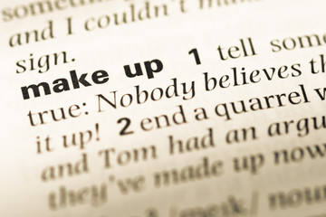 Close up of old English dictionary page with word make up