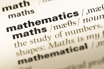 Close up of old English dictionary page with word mathematics