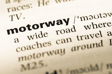 Close up of old English dictionary page with word motorway