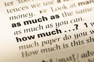 Fototapeta premium Close up of old English dictionary page with word as much as