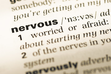 Fototapeta premium Close up of old English dictionary page with word nervous