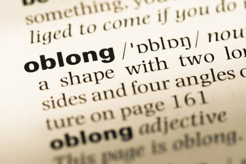 Fototapeta premium Close up of old English dictionary page with word oblong