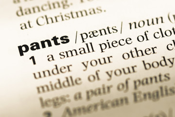 Obraz premium Close up of old English dictionary page with word pants