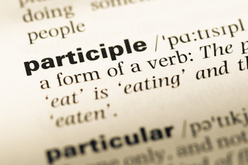 Close up of old English dictionary page with word participle