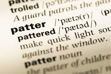 Fototapeta premium Close up of old English dictionary page with word patter