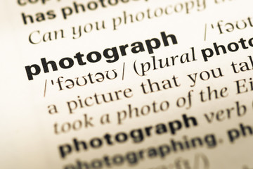 Fototapeta premium Close up of old English dictionary page with word photograph