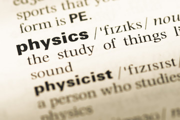 Close up of old English dictionary page with word physics