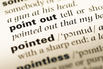 Obraz premium Close up of old English dictionary page with word point out