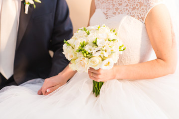 Obraz na płótnie Canvas Bride holding big bridal bouquet on wedding ceremony