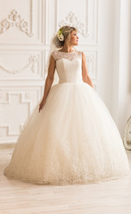 Fototapeta premium Portrait of beautiful bride. Wedding dress and decoration