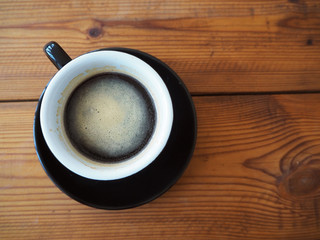 Black coffee on wood table