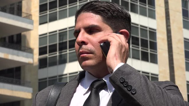 Angry Business Man Talking On Cell Phone