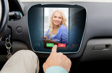 close up of man using phone application in car