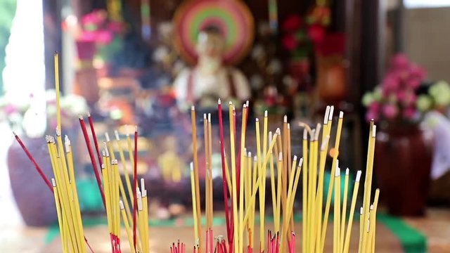 Close up incense at Buddhist monastery Wat Phnom, Cambodia