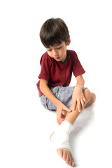 Little boy has an accident with his leg need bandage for first aid