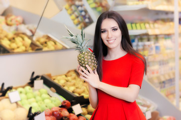 Happy Woman with Pineapple Fruit in Supermarket