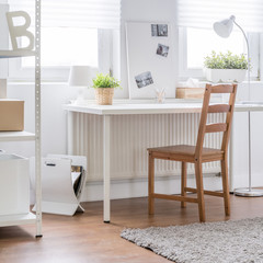 Wooden chair in white interior