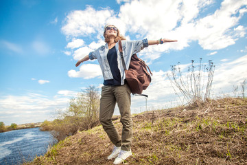 beautiful young woman walking in the nature, enjoying life. Summ