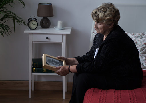 Elderly widowed lady in grief