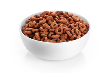Bowl with chocolate corn rings isolated on white background. Cer