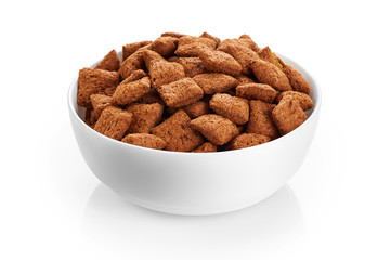 Bowl with chocolate corn pads isolated on white background. Cere
