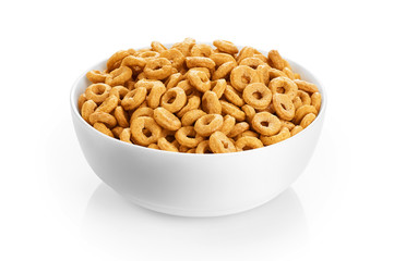 Bowl with corn rings isolated on white background. Cereals.