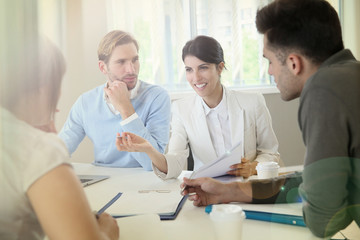 Business people meeting around table in modern space