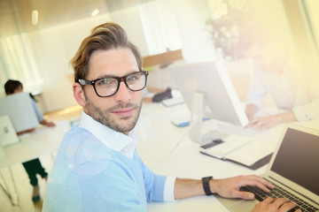 Businessman with eyeglasses working in office