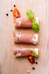 Black forest ham on wooden cutting board