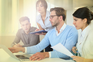 Group of business people working on laptop