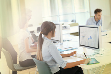 Obraz premium Creative people working in office on computer