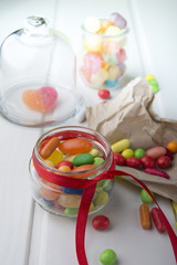Multicolor candies in glass jars