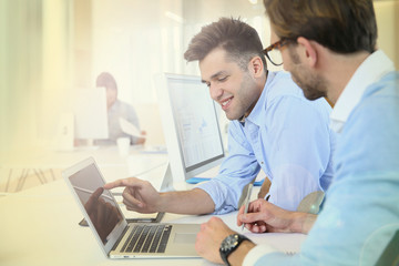 Obraz na płótnie Canvas Businessmen in work meeting with laptop computer