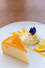 Orange cake on white plate. (Selected focus)