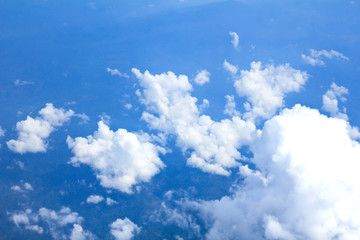 Fototapeta na wymiar Blue sky and Clouds looking from the Airplane