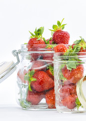 fresh whole strawberries in wooden bowl