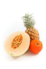 A Pineapple, An Orange and A Half of Cantaloupe Melon Isolated, White Background