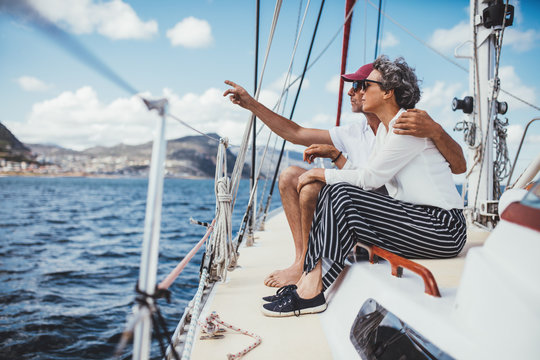 Mature couple relaxing on yacht