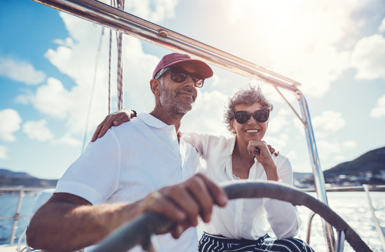 Happy mature couple on yacht