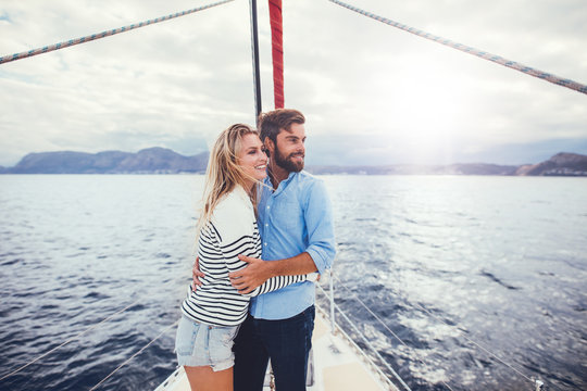 Young couple relaxing on yacht