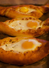 Beautiful open pies khachapuri with egg