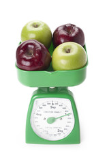 mixed apples on a scale