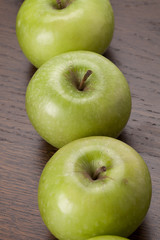 granny smith apples in a row